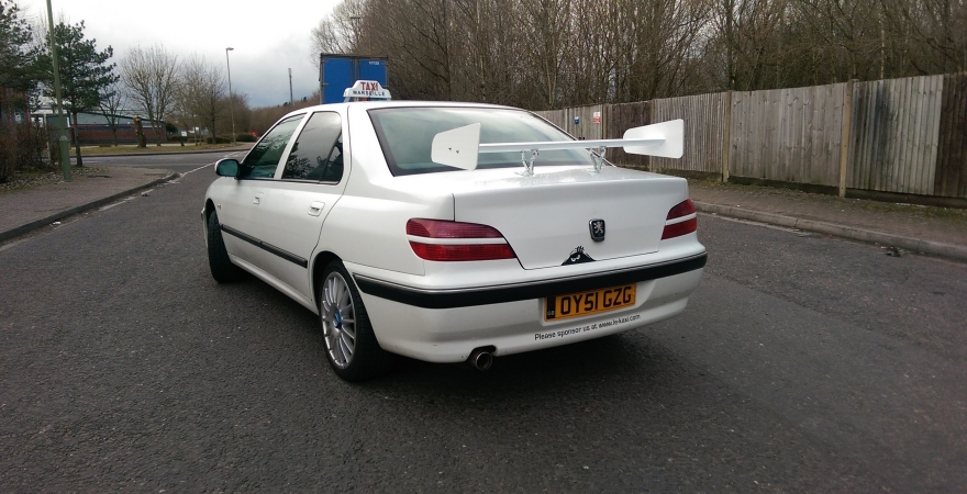 "add a taxi sign and rear spoiler .."